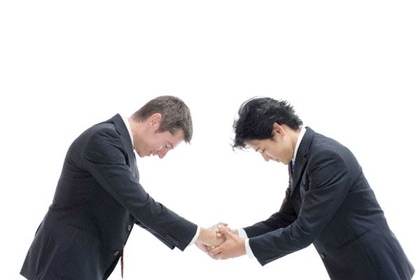 bowing and shaking hands